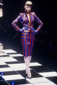 Red and blue leather paneled skirtsuit in the Givenchy Fall/Winter 1998 Ready-to-Wear show in Paris designed by Alexander McQueen
