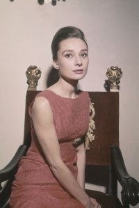Begian-born movie star Audrey Hepburn shown at her Rome hotel on . Hepburn wears a rose-colored sheath silk brocade cocktail dress, a creation by Hubert Givenchy fashion house of Paris. Hepburn is one of the twelve best dress women of 1959. She was voted to the list by the New York couture groupAudrey Hepburn, Rome, Italy