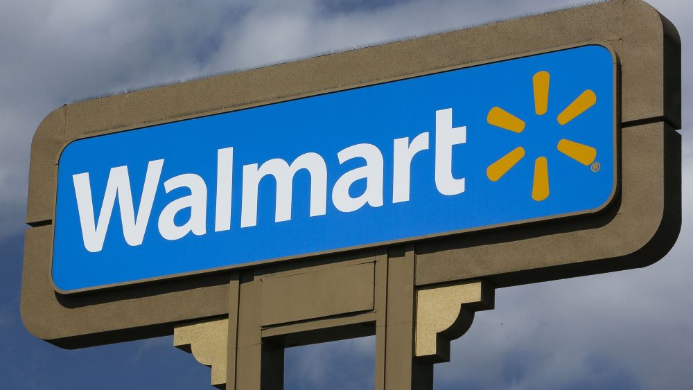 Wal-Mart Signage outside a Wal-Mart store in Duarte, Calif. Wal-Mart is promising it won't be beat on prices this holiday season. But online shoppers shouldn't expect free shipping without any restrictionsRetail Holiday, Duarte, USA