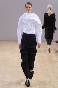 A model on the runway at J. W. Anderson's fall 2014 show.