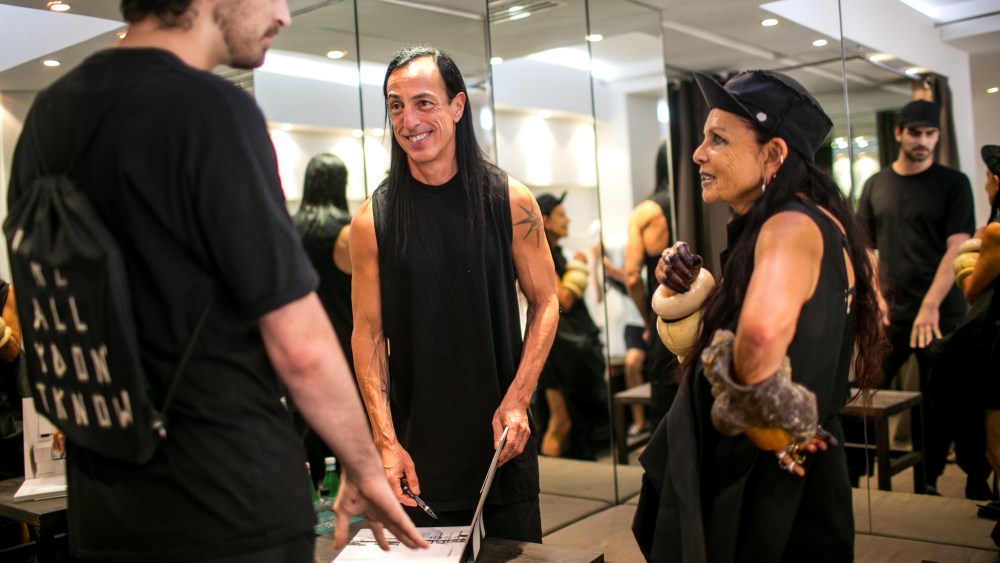 Rick Owens and Michèle Lamy sign a copy of their book.