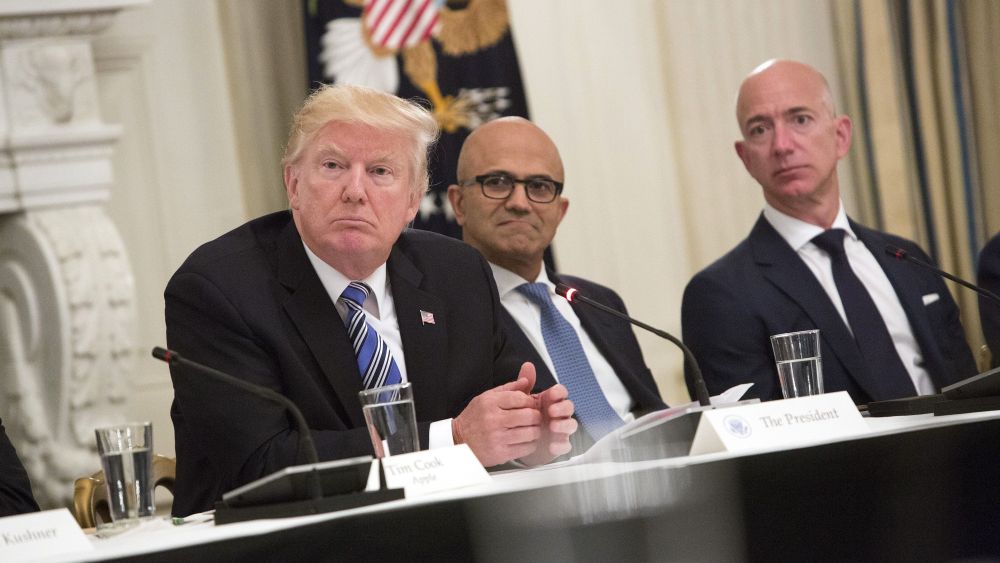 United States President Donald J. Trump (left) participates in an American Technology Council roundtable with corporate and eduction leaders including Microsoft CEO Satya Narayan (center) and Amazon CEO Jeff Bezos (right).White House tech summit, Washington DC, USA - 19 Jun 2017