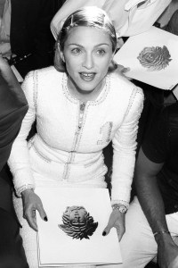 Singer Madonna seated front row at the Spring 1996 Versace runway show on July 11, 1995, in Paris, France.