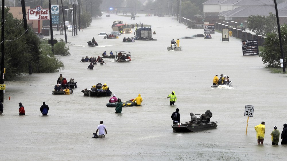 Flood evacuees Rescue boats fill a flooded street at flood victims are evacuated as floodwaters from Tropical Storm Harvey rise, in HoustonHarvey, Houston, USA - 28 Aug 2017