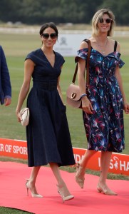 Meghan, Duchess of Sussex arrives with Delfina Blaquier, the wife of Nacho Figueras at the Royal County of Berkshire Polo Club in Windsor, England, to watch the Sentebale Polo Cup