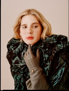 Marc JacobsÕ taffeta rosette collar blouse and gloves; GucciÕs crystal embroidered viscose velvet skirt; Mounser earring; Spinelli Kilcollin earring and rings; Calvin Klein 205W39NYC boots.