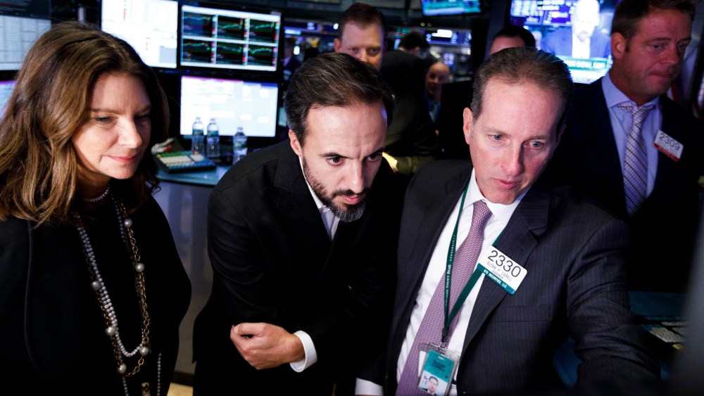 Jose Neves (C), the CEO of Farfetch, an online fashion house, talks with specialists during the company's IPO at the New York Stock Exchange in New York, New York, USA, on 21 September 2018.Farfetch IPO at New York Stock Exchange, USA - 21 Sep 2018