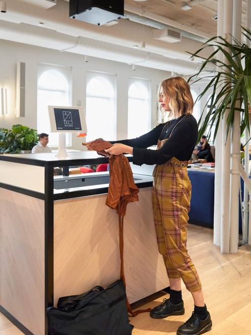 A Rent the Runway clothing drop-off box at a WeWork location.