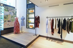 In the windows, mannequins are positioned against scenic watercolors by Altuzarra.