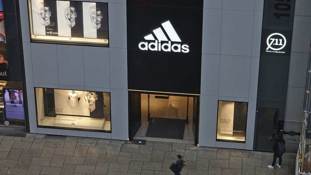 A view through a window showing a pedestrian passing a Adidas store at the main pedestrian area Zeil, 08 November 2017 in Frankfurt, Germany.Frankfurt economy, Frankfurt Am Main, Germany - 08 Nov 2017