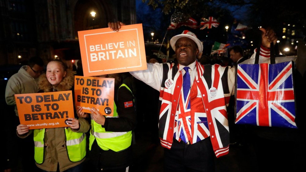 Pro-Brexit leave the European Union supporters react outside the Houses of Parliament in London, . British lawmakers have voted to delay Brexit, just 15 days before the country is scheduled to leave the European Union. The House of Commons voted by 412-202 in favor of seeking to postpone the U.K.'s departure for at least three months beyond the scheduled March 29 departure from the EUBrexit, London, United Kingdom - 14 Mar 2019