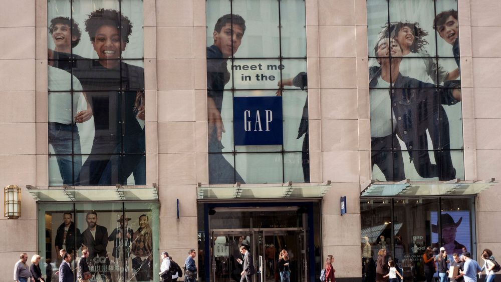 People walk by the advertising for a Gap store on New York's Fifth Avenue. Diversity in the advertising industry is becoming a higher priority for consumer product companies as they try to reach a new generation of customers with evolving sensibilities on ethnicity, age, gender and sexualityDiverse Advertising-Getting it Right, New York, USA - 23 Oct 2017