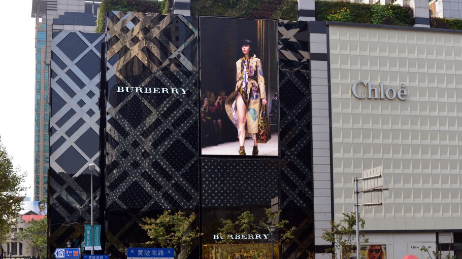 Burberry store with screen featuring footage of models walking, and Chloe boutique on the fashionable Huangpi Road in Shanghai .