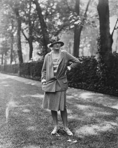 French fashion designer Coco Chanel (1883-1971) wearing a design of her own creation poses in a garden on the Rue du Faubourg Saint-Honore, Paris, France, 30th May 1929. Chanel owned an apartment on the rue du Faubourg Saint-Honore. (Photo by Sasha/Evening Standard/Hulton Archive/Getty Images)