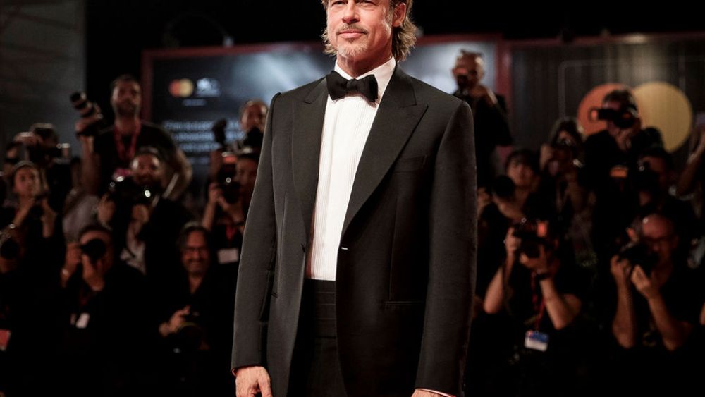 Brad Pitt wearing a Brioni black bespoke tuxedo at the 2019 Venice Film Festival.