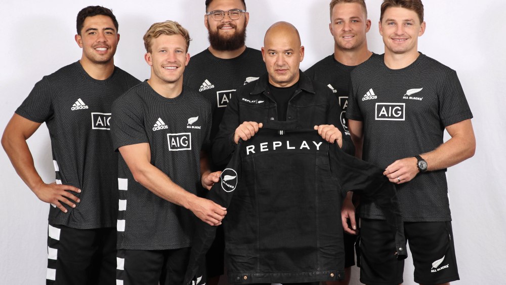 Replay's ceo Matteo Sinigaglia poses with All Black players Anton Lienert Brown, Damien McKenzie, Angus Ta'avao, Sam Cane and Beauden Barrett.
