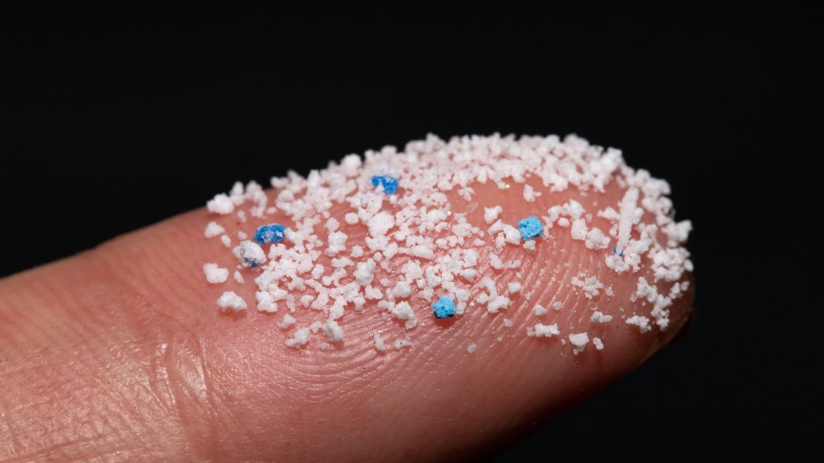 Small Plastic pellets on the finger.Micro plastic. air pollution