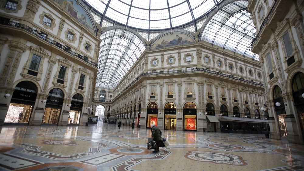 A nearly deserted Galleria Vittorio Emanuele II, Italy's oldest active shopping mall, in downtown Milan, Italy .