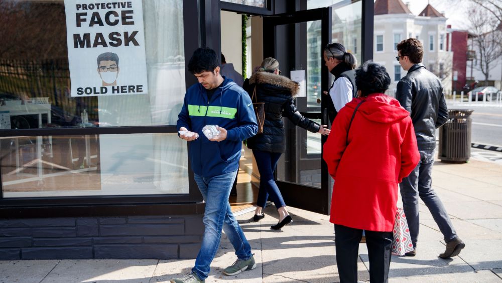 Customers line up outside a pop up shop offering hand sanitizer, rubber gloves and face masks in Washington, DC, USA, 06 March 2020. There are 245 confirmed cases with 14 deaths in the US as the COVID-19 coronavirus continues to spread.Locals shop for hand sanitizer, rubber gloves and face masks as coronavirus spreads, Washington, USA - 06 Mar 2020