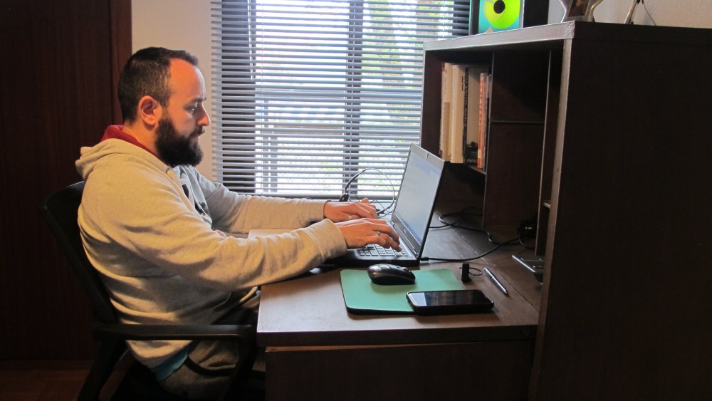 A man works from home in Madrid, Spain, 17 March 2020 (issued 18 March 2020). Spanish working parents must try to keep their kids entertained at home while they remote work amid an unprecedented public health crisis in Spain.Millions of Spanish school children stuck at home, Madrid, Spain - 17 Mar 2020