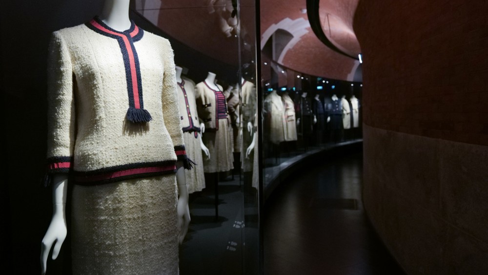 Caption: Chanel tweed suits are displayed in the new “Gabrielle Chanel Galleries” at Palais Galliera.
