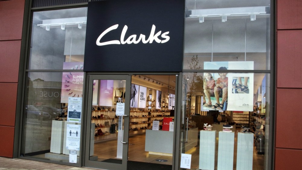 Footwear firm Clarks has a $128.8 million rescue deal with LionRock Capital, but creditor approval would force more store closures.