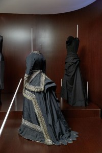 An 1870 American mourning dress with a 1939 Elsa Schiaparelli evening dress.