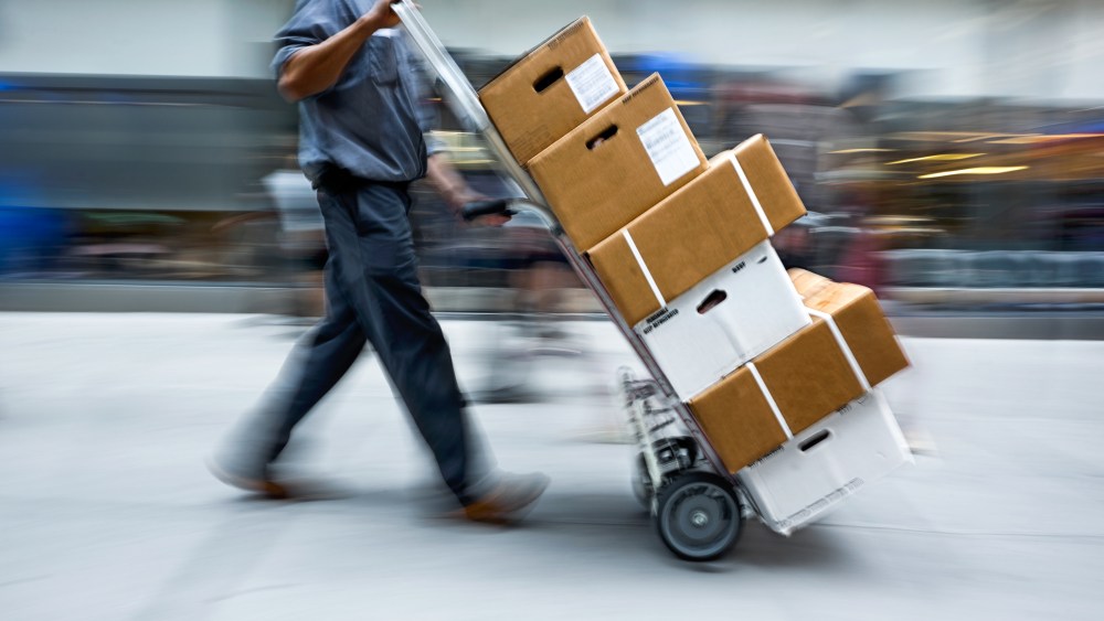 delivery goods with dolly by hand, purposely motion blur