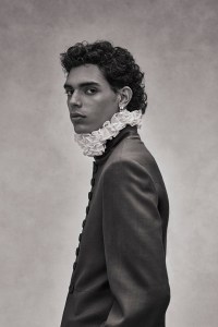Dior Men’s wool and mohair jacket. Agmes earring; Philosophy ruffle-neck collar.