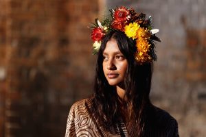 SYDNEY, AUSTRALIA - MAY 31: Indigenous model Lisa Fatnowna poses at the Welcome To Country for Afterpay Australian Fashion Week 2021 at the Blacksmith's Workshop, Carriageworks on May 31, 2021 in Sydney, Australia. (Photo by Cameron Spencer/Getty Images)