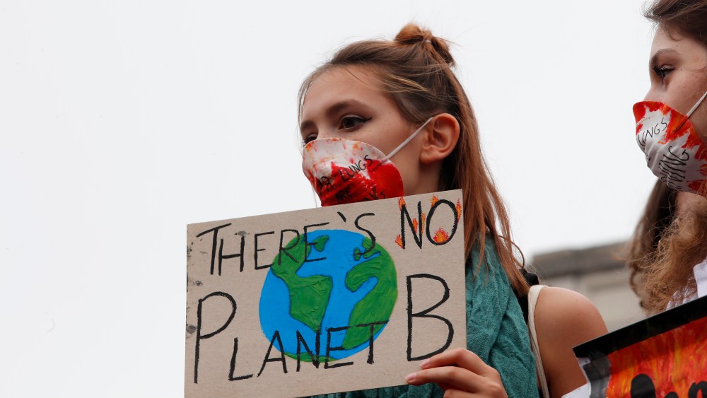 Students demonstrate during a worldwide protest demanding action on climate change in Milan, Italy, Friday, Sept. 27, 2019. The protests are inspired by Swedish teenager Greta Thunberg, who spoke to world leaders at a United Nations summit this week. (AP Photo/Antonio Calanni)