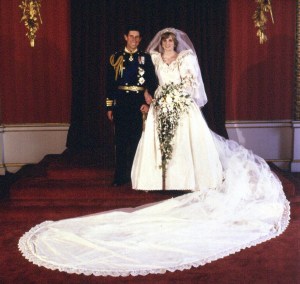 File photo dated 29/07/1981 or The Prince and Princess of Wales at Buckingham Palace after their wedding at St Paul's Cathedral. A copy of the wedding dress worn by Diana, Princess of Wales, which went under the hammer for £100,000 Wednesday December 7, 2005. See PA story SALE Dress. PRESS ASSOCIATION Photo. Photo credit should read: Idea Ge (Press Association via AP Images)