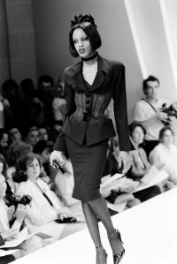 Model Connie Fleming walks the runway in a suit from Thierry Mugler's fall 1992 debut couture, ready to wear blended runway show.