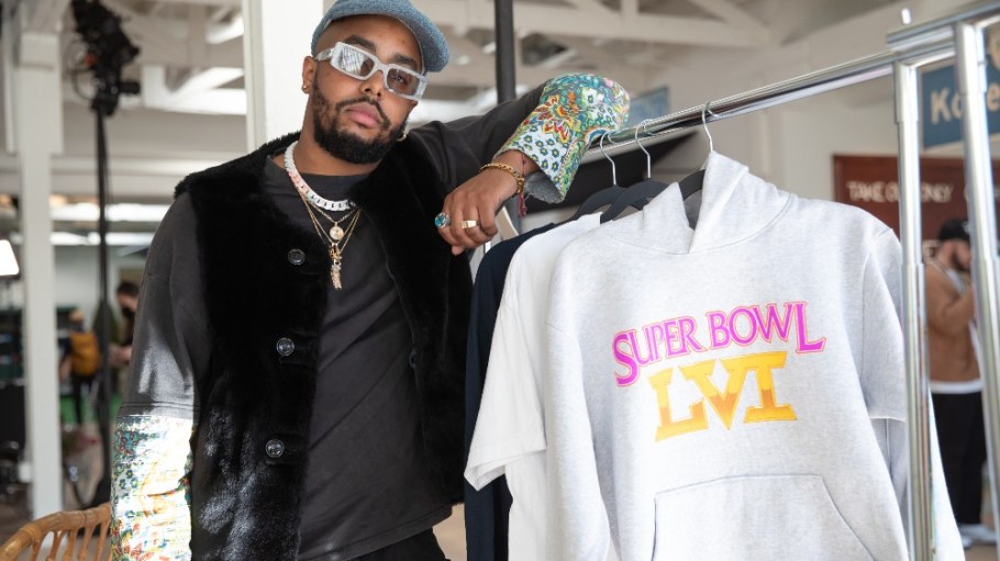 Kacey Lynch, CEO and founder of Bricks & Wood, poses with a hoodie designed for the Origins collection. The NFL tapped four Los Angeles-born, BIPOC-owned fashion brands to create official Super Bowl LVI merchandise like T-shirts and hoodies.