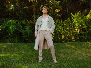 Fendi’s suede trenchcoat over Tom Ford’s viscose tank top; Brioni’s wool and silk blend pants. David Yurman Ring.