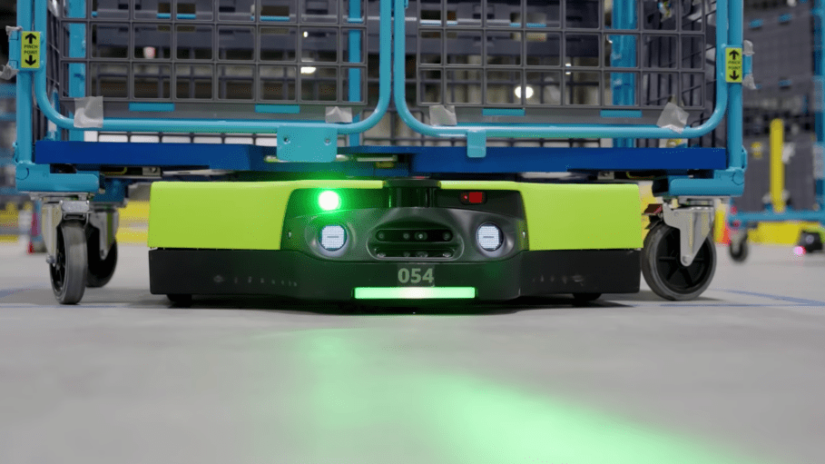 The Amazon Proteus robot emits a green beam (seen here) ahead of it while it moves. The bot will stop if a human worker steps in front of the beam.