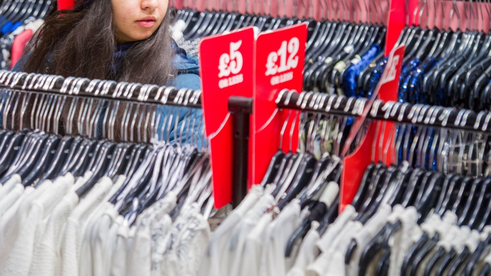 A woman looking at clothes in a shop as shoppers are being urged to challenge fashion brands over where their products are made and how much workers in the supply chain are paid. Issue date: Friday April 24, 2015. A new report was launched to coincide with Fashion Revolution Day today, the second anniversary of the Rana Plaza factory collapse in Bangladesh in which more than 1,000 workers died. A campaign running in 71 countries, including the UK, encourages fashion lovers to challenge global brands to demonstrate commitment to transparency across the supply chain. ÒIf companies donÕt know how and where their products are made, then thereÕs no way for them to ensure their workers are protected. Transparency is important because it shows a companyÕs willingness to be held accountable for its supply chain and this builds up public trust," said Orsola de Castro, co-founder of Fashion Revolution Day. See PA story INDUSTRY Fashion. Photo credit should read: Anthony Upton/PA Wire URN:22818401