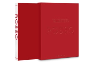 The cover of Assouline's new "Valentino Rosso" comes in a red box embossed with the title with the hardcover book, also red but with a white spine and red lettering reading "Rosso" comes inside.