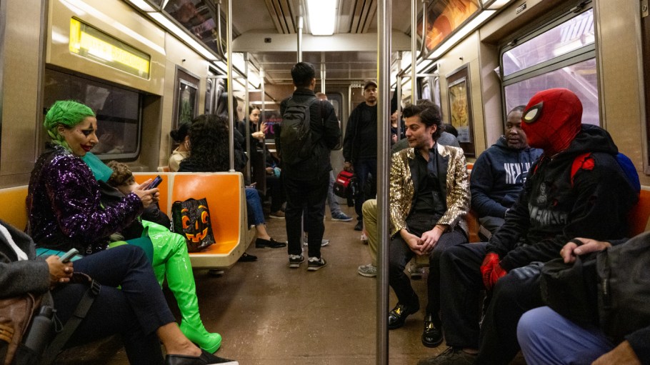 NEW YORK, NEW YORK - OCTOBER 31: People in costumes ride the subway on Halloween on October 31, 2022 in New York City. Since Halloween falls on a Monday this year, Halloween-related activities are being held through the weekend and into the beginning of next week.