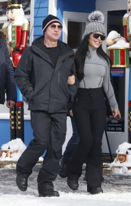 Jeff Bezos and his girlfriend Lauren Sanchez are seen flanked by heavy security as they leave the white house tavern in Aspen on Dec 29, 2022.