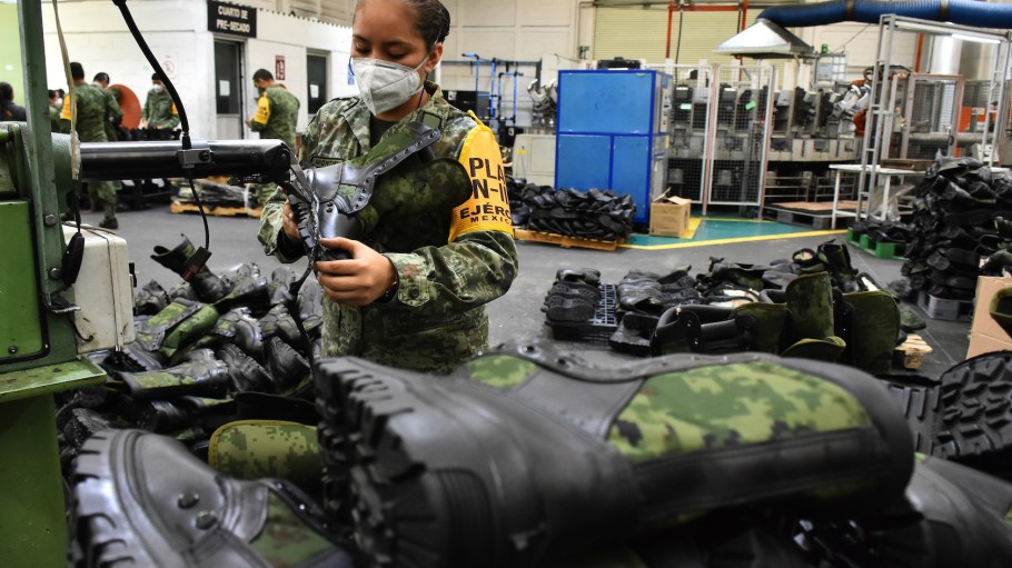 A military woman is seen during the production process of Mexican Army boots at the Factory of Military Clothing and Equipment. Mexico is gaining steam as a popular apparel manufacturing hub as more companies seek alternatives to China.
