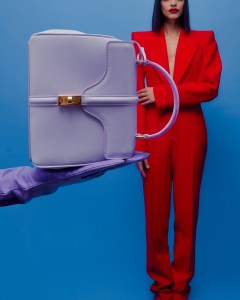 Celine’s Mini 16 handbag in satinated calfskin. Alexander McQueen’s wool all-in-one jumpsuit; Wing & Weft leather gloves.