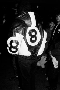 A guest in an 8 Ball hoodied leather jacket attends a pre-concert tour party for Hip Hop Groups Run DMC and EPMD on in New York City, 1991.