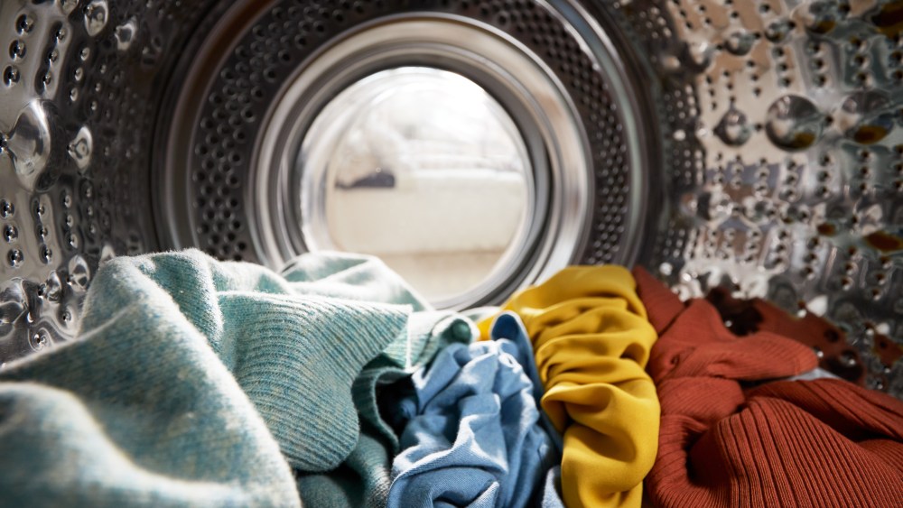 View Looking Out From Inside Washing Machine Filled With Laundry