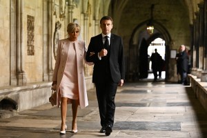 LONDON, ENGLAND - MAY 06: French President Emmanuel Macron and his wife Brigitte Macron arrive to take their seats ahead of the Coronation of King Charles III and Queen Camilla on May 6, 2023 in London, England. The Coronation of Charles III and his wife, Camilla, as King and Queen of the United Kingdom of Great Britain and Northern Ireland, and the other Commonwealth realms takes place at Westminster Abbey today. Charles acceded to the throne on 8 September 2022, upon the death of his mother, Elizabeth II. (Photo by Ben Stansall - WPA Pool/Getty Images)