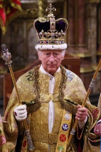 LONDON, ENGLAND - MAY 06:  King Charles III stands after being crowned during his coronation ceremony in Westminster Abbey, on May 6, 2023 in London, England. The Coronation of Charles III and his wife, Camilla, as King and Queen of the United Kingdom of Great Britain and Northern Ireland, and the other Commonwealth realms takes place at Westminster Abbey today. Charles acceded to the throne on 8 September 2022, upon the death of his mother, Elizabeth II. (Photo by Richard Pohle - WPA Pool/Getty Images)