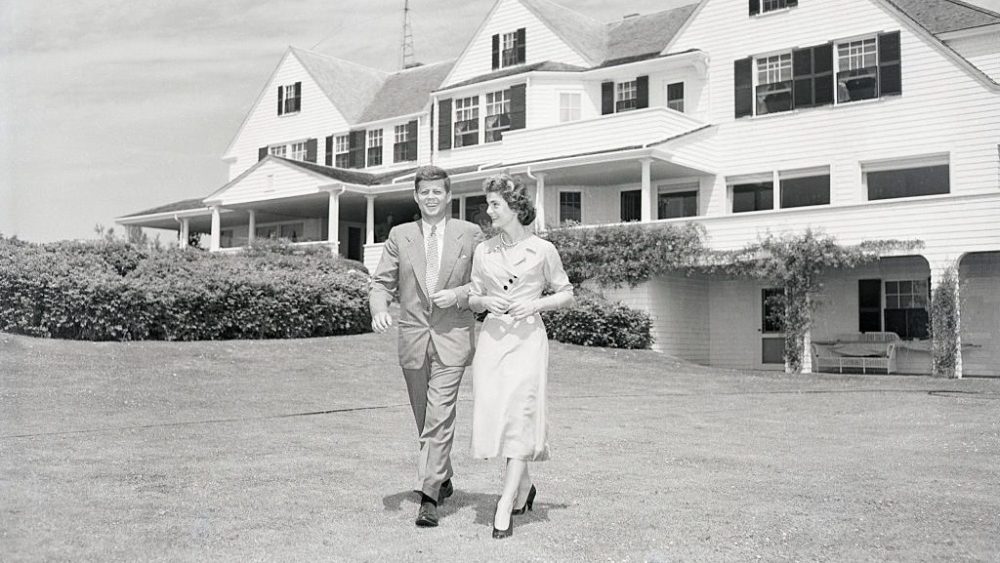 John F. Kennedy, Jacqueline Kennedy, stroll across the lawn of his family's Hyannisport home after announcing their engagement, kennedy compound