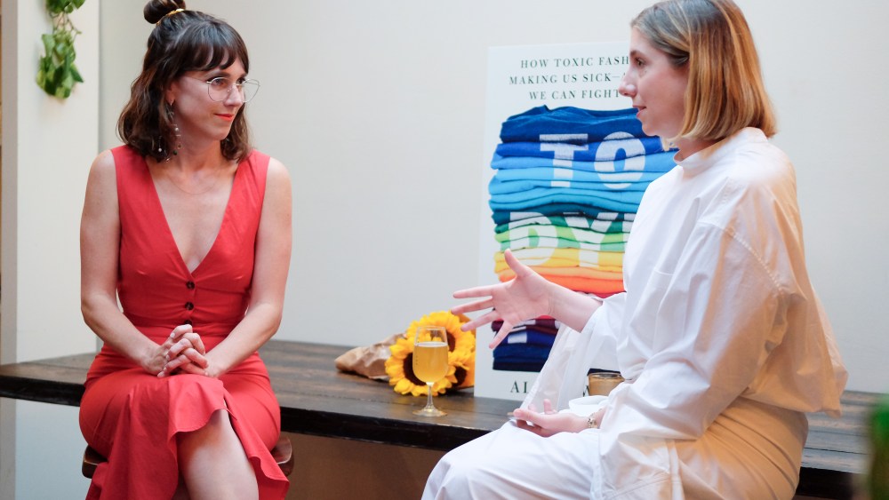 Alden Wicker, author of "To Dye For" about toxic fashion wearing a coral v-neck dress interviewed by Sarah Spellings, dressed in all white.