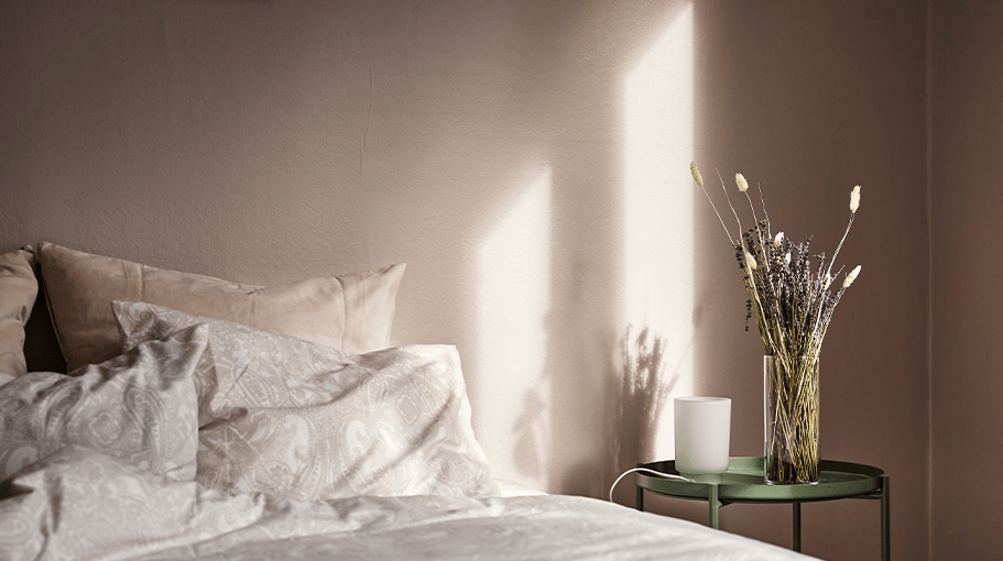 bed with lavender on nightstand