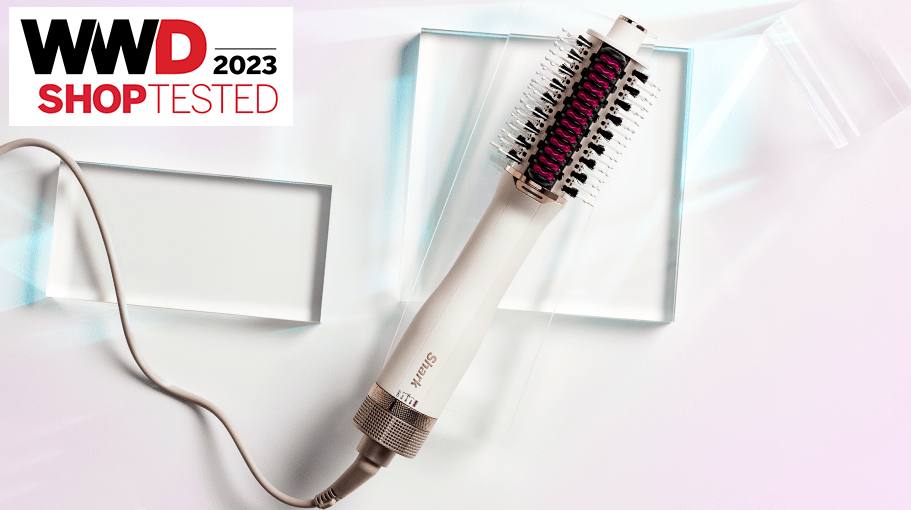 hair dryer brush on a pink background